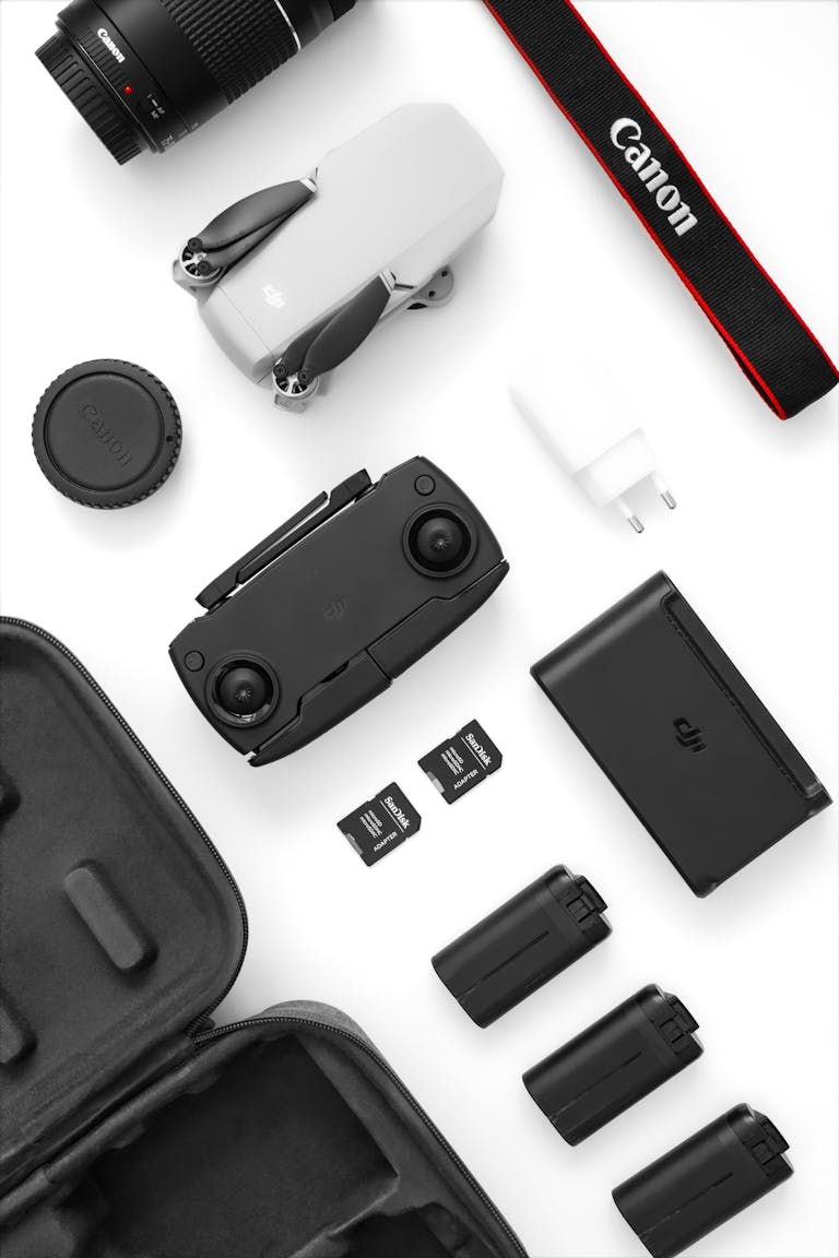 Vivo Y500 Battery High-angle shot of camera gear and drones on a white background, ideal for tech enthusiasts.