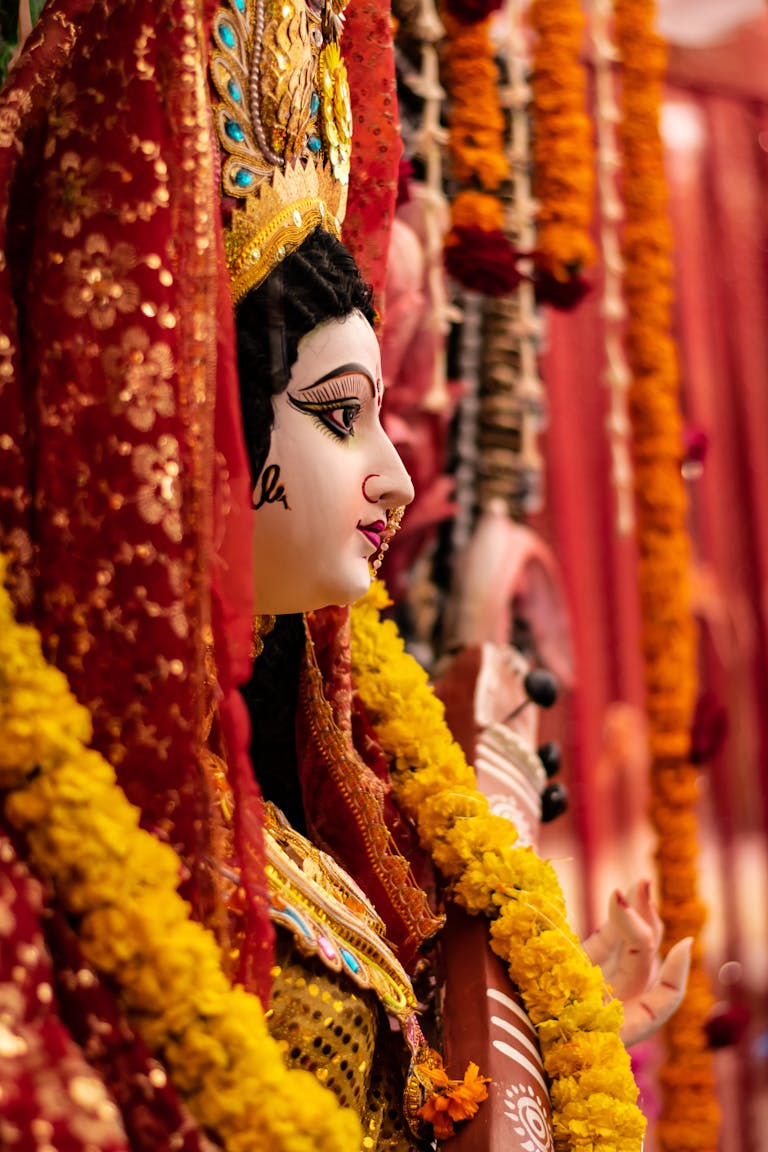 Durga Puja Vibrant side view of Maa Durga idol adorned with flowers during India festival.