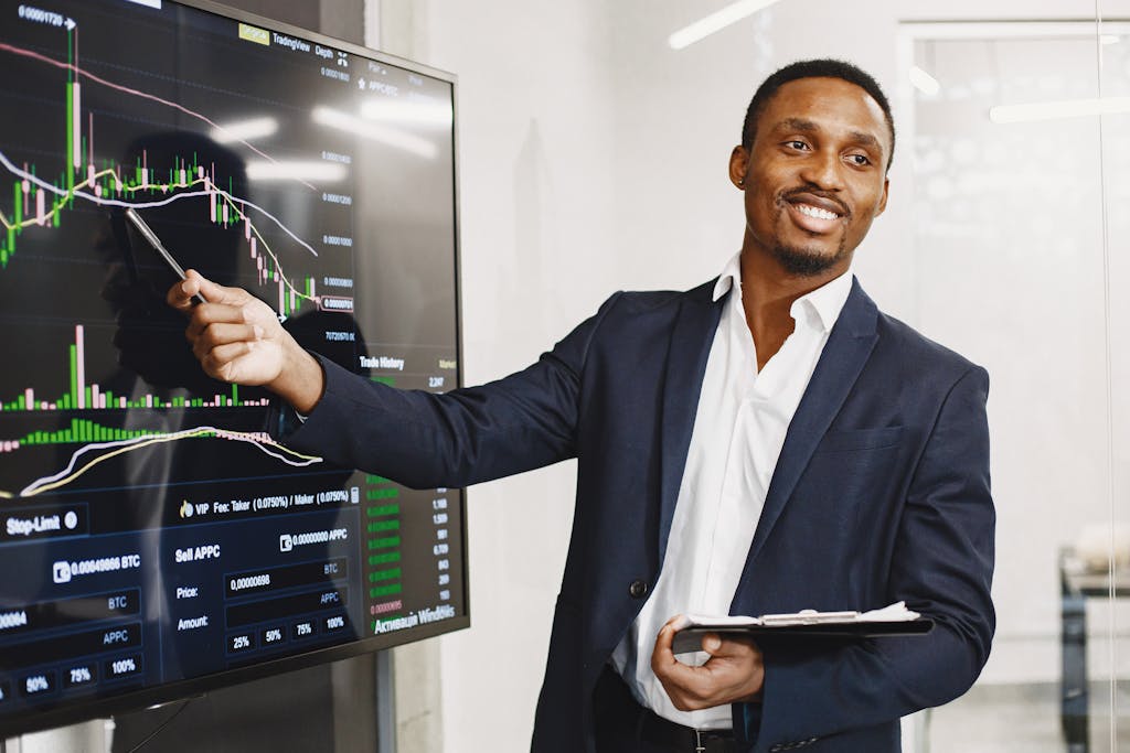 Smart Finance Tips and Updates for 2025Smart Finance Tips and Updates for 2025 Businessman presents financial data using graphs, showcasing technology and analysis in a corporate environment.