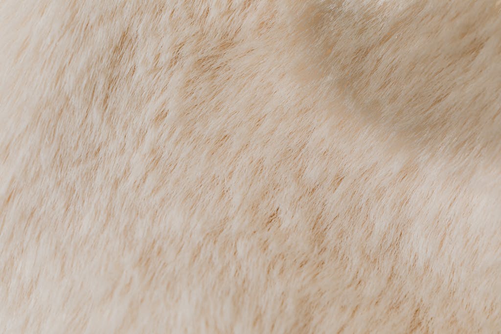 Hormita Detailed close-up of beige animal fur texture, ideal for backgrounds and design projects.