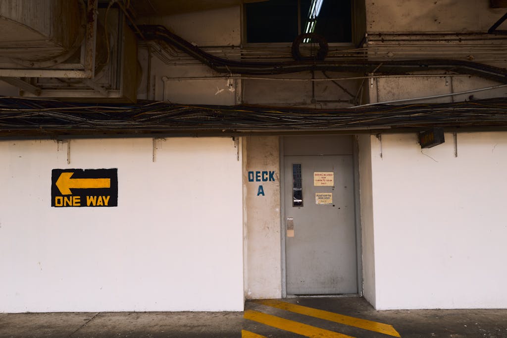 vRealize Infrastructure Navigator Exterior view of an industrial building with cables and a one way sign for navigation.